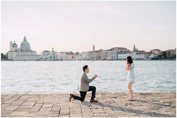 man proposing near river side